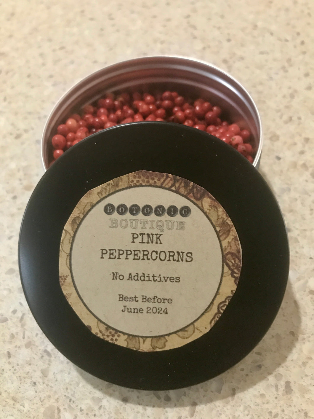 GARNISH: Pink Peppercorn Tin